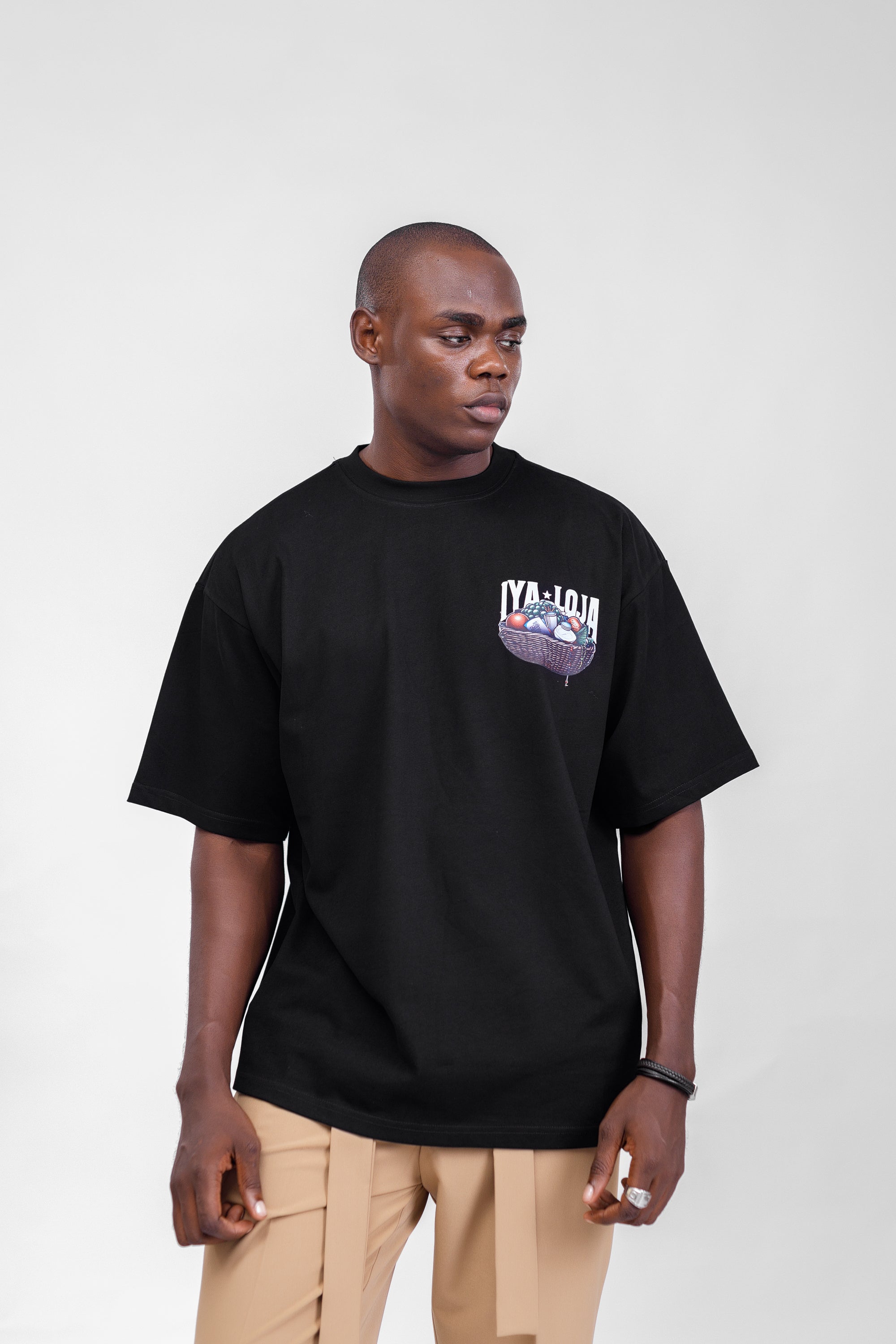 Iyaloja Tee (Pocket Logo) in Black